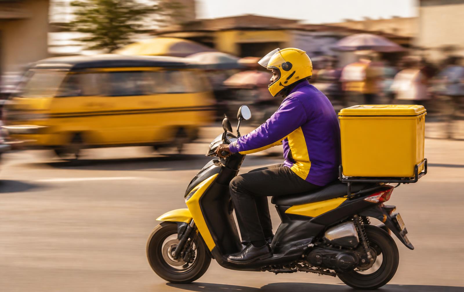 NovaGo scooter rider delivering an order through a city street